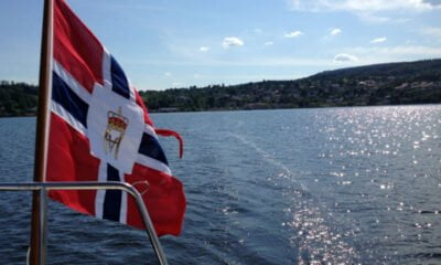 Norwegian flag over the water