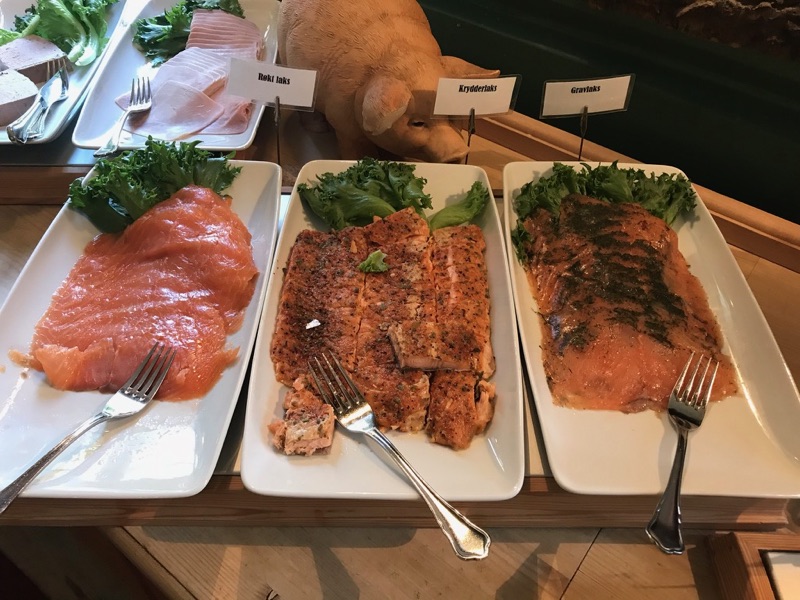 A range of salmon at a hotel breakfast buffet.