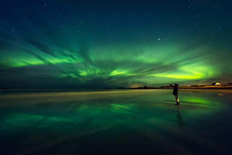 Northern lights reflections in the water