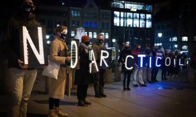A coalition of environment organisations and public gather for a Covid 19 safe demonstration of light, close to the parliament building (Stortinget) in central Oslo. Young Friends of the Earth Norway (Nature and Youth) and Greenpeace are taking the Norwegian government to the supreme court of Norway for opening up new oil fields in the fragile and diminishing Arctic.