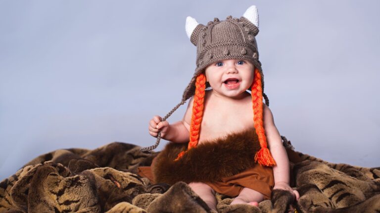 Baby boy with Norway Viking helmet.