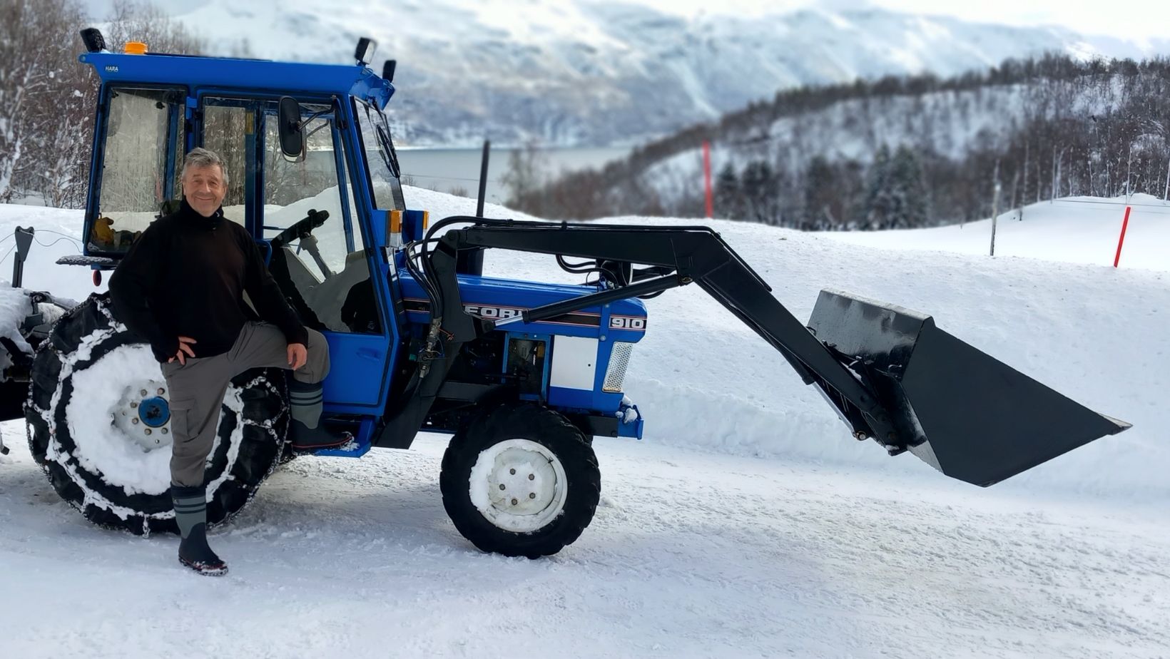 Trevor with the snow plough in the winter.