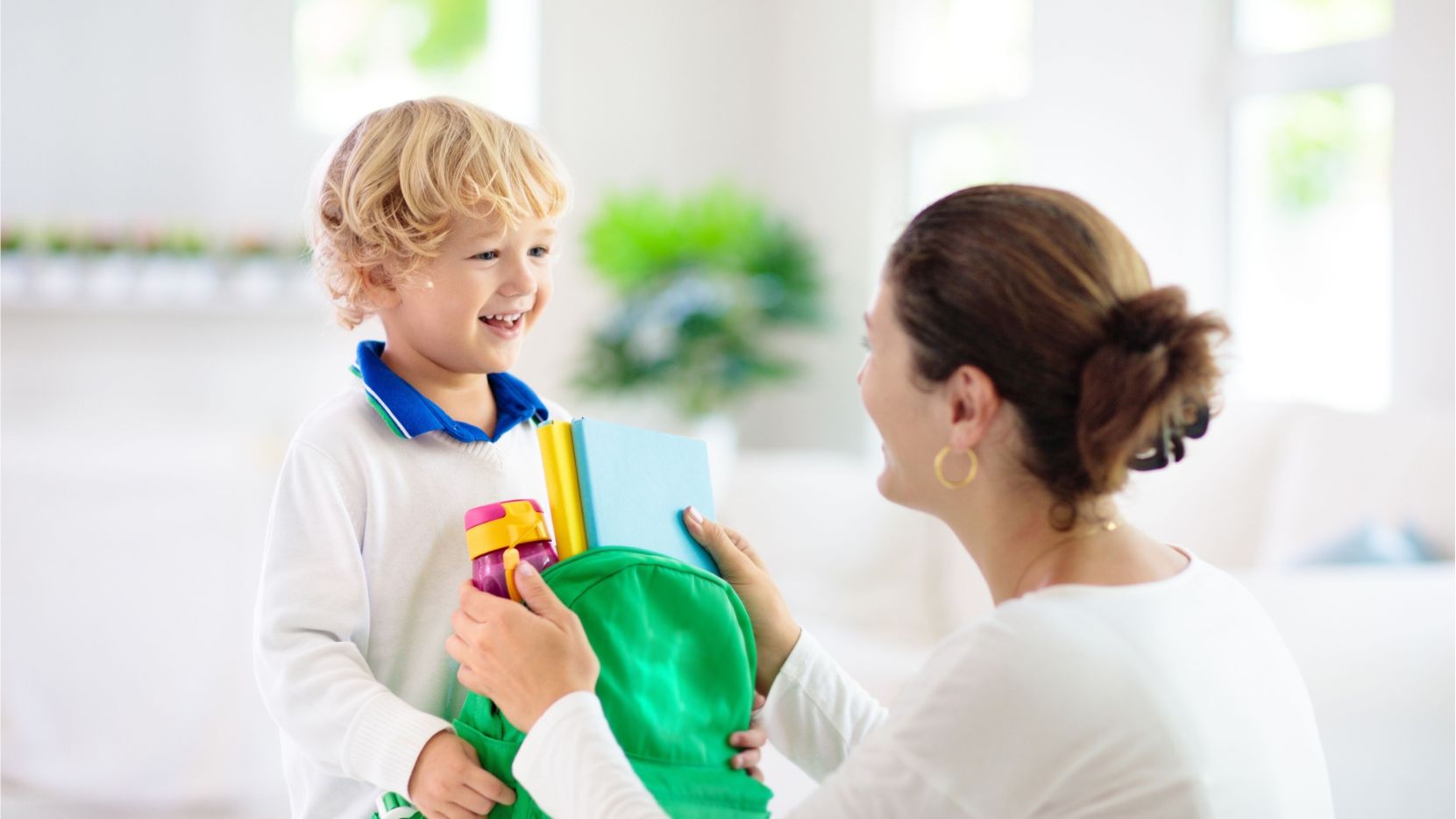 Young boy getting ready for kindergarten.