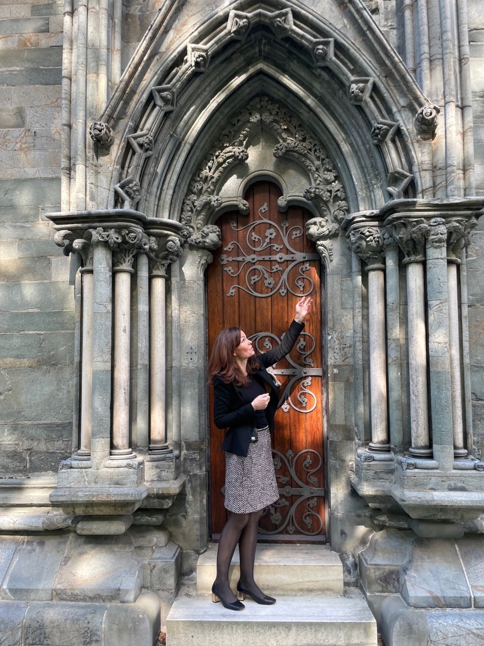 Margrete Syrstad Andås in the external doorway that leads to the Octagon in Nidaros Cathedral. Photo: Nancy Bazilchuk, NTNU.