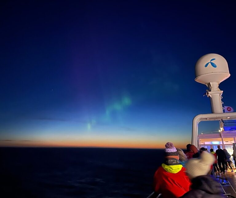 Aurora borealis seen at sunset. Photo: David Nikel.